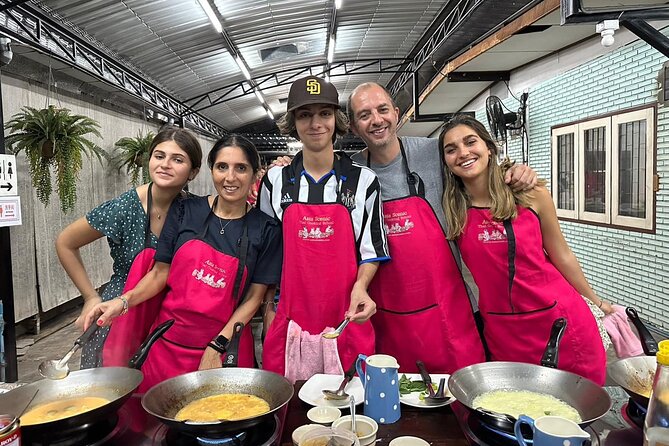 Authentic Thai Cooking Class and Farm Visit in Chiang Mai - Cooking in the open-air kitchen