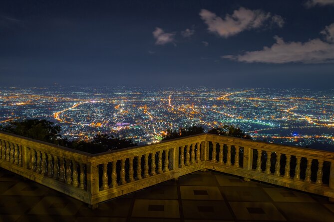Chiang Mai: Evening Tour to Doi Suthep & Wat Pha Lat - Doi Suthep after dark, gold, steps, and city views