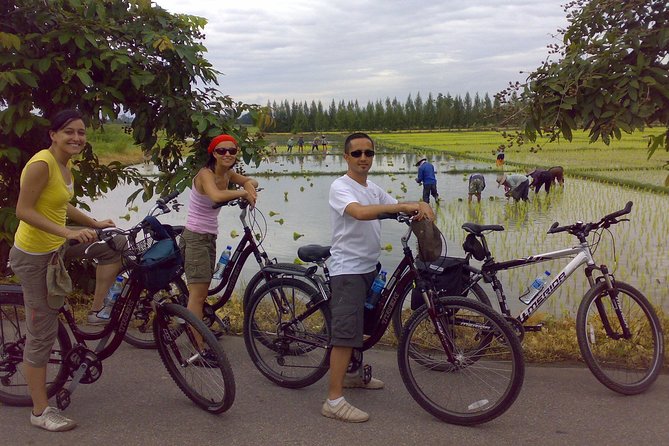 Chiang Mai Paradise Full-Day Cycling Adventure Tour - Temples, paper garlands, and daily Buddhist life
