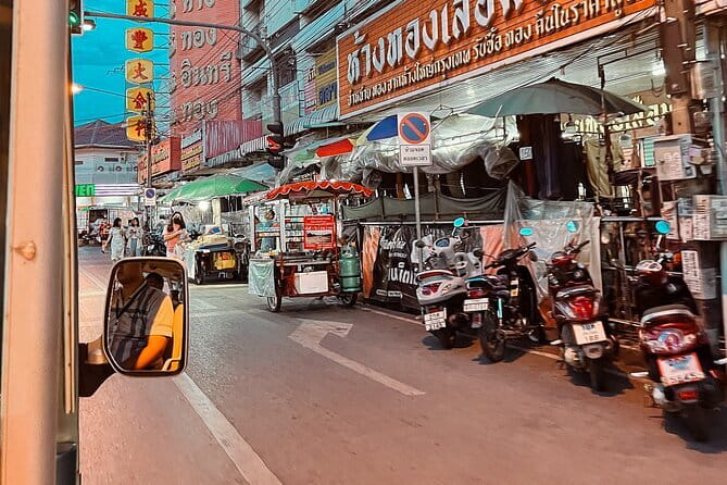 Guided Chiang Mai City Night Tour by EV Tram - Chang Puek Gate connects temples with street food