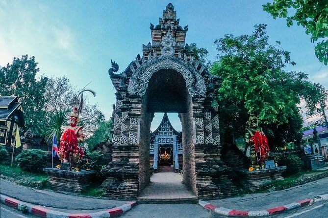 Guided Chiang Mai City Night Tour by EV Tram - Wat Chiang Man shows early Lanna style