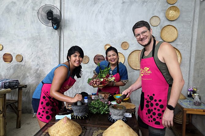 Signature Thai Cooking Course - An open-air kitchen with a meal at the end